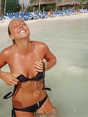 Bikini girls love getting sun tanned on the beach