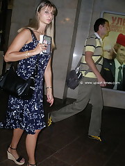 Long-legged babe standing on the limpid floor with camera hidden in it