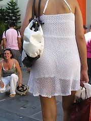 Panty upskirt - brunette in white dress voyeured