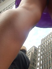Chick upskirt, looking up purple skirt on the street