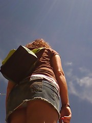 Curly babe has very sexy butt, up the skirt