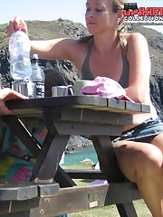 Sitting upskirt, of a nice blonde in mini skirt
