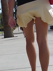 Young blonde in white mini on the street. Real upskirt celebrity upskirt