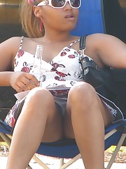This chocolate babe is very hot. Up the skirt upskirt pic