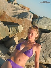 Warm waves washing bikini girl's sweet body up skirt pic