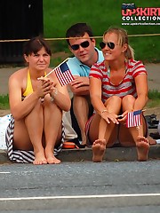 Upskirting. two ckicks in striped dresses upskirt shot