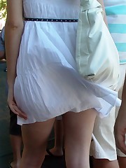 Pics wind blowing up skirts. Slim blondie caught candid upskirt