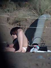 Upskirts on the beach - cute brunette flashed up skirt pic