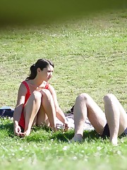 Squat upskirt. Squatting brunette on a glade voyeured celebrity upskirt