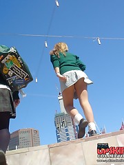 Schoolgirl upskirt - legal teen in green skirt spyed upskirt pic