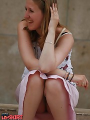 Sitting upskirt. Cutie voyeured in public place upskirt no panties