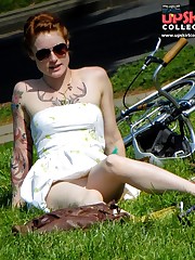 Tattooed redhead voyeured in a park. Sexy upskirt celebrity upskirt