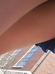 Pretty brunette in blue skirt. Candid street upskirt teen upskirt