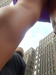 Chick upskirt, looking up purple skirt on the street upskirt shot