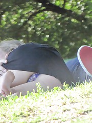 Blonde has bald pussy, in panty, up her black skirt up skirt pic