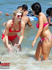 Girl in swimsuits entertain in sea candid upskirt