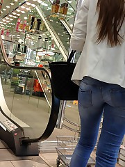 Hot women tease with ultra low jeans upskirt pic
