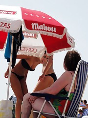 Relaxing on the beach bikini babes upskirt shot