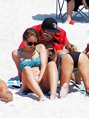 Swimsuit teens spend time on beach upskirt shot