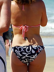 Voyeured girls in swimsuits on beach upskirt picture