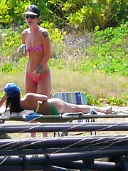 Beautiful bikini chicks on the sand up skirt pic