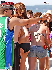 Bikini beauties play on the beach upskirt shot