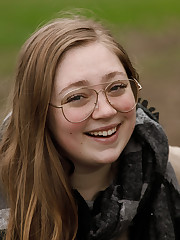 Portland does not have a lot of direct sunshine this time of year, but it does have Rose Fessenden, and that is more than enough reason for me to visit. Here she is teasing my socks off in a park. Hope you enjoy her unique beauty. upskirt picture