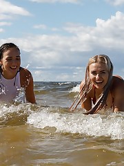 Back to my wacky adventures in Latvia. If you will recall, one girl had to jet, so I was left on the beach with this duo. Lauma, the blonde, was the only one who had packed a proper bikini. She lent Oxana her white top, who had decided panties would fair just fine in the water. I felt really bad and didn't want to make anyone self-conscious, so I eventually asked them both to remove everything. I'm firm, but I'm fair. This was a great day with a great team. Adios, Summer. upskirt shot