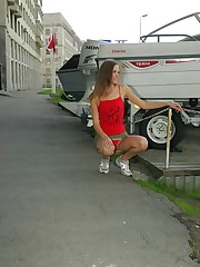 Sportif gal wears sexy red panties and willingly shows them