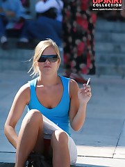 Smoking blonde in mini spyed, up skirt sitting