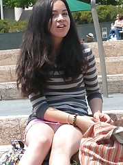 Very hot brunette in mini, up skirts sitting