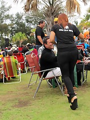 Women in skin tight jeans under sun